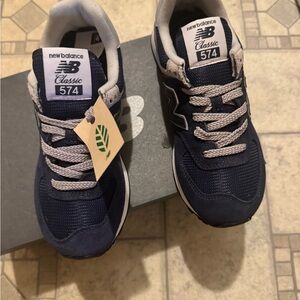 New Balance women’s 574 Navy and White Sneakers